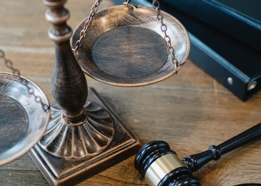 symbols of justice and law on table of judge