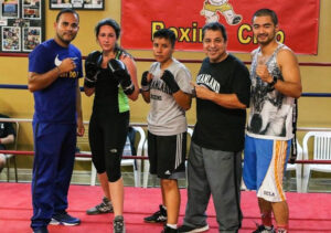 Sandra Magallon, Jesse Huerta and Coach Ian Cruz at Dreamland Boxing