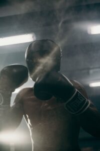 man in black boxing gloves