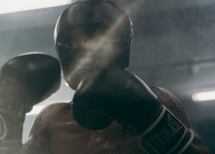 man in black boxing gloves